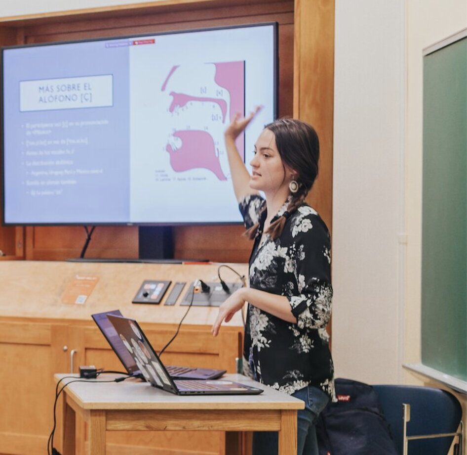 a graduate student in the classroom teaching