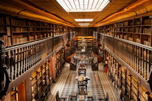 A photograph of a library filled with books