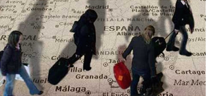Figures walking on map of Spain