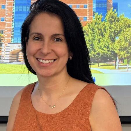 Profile photograph of a woman smiling. 